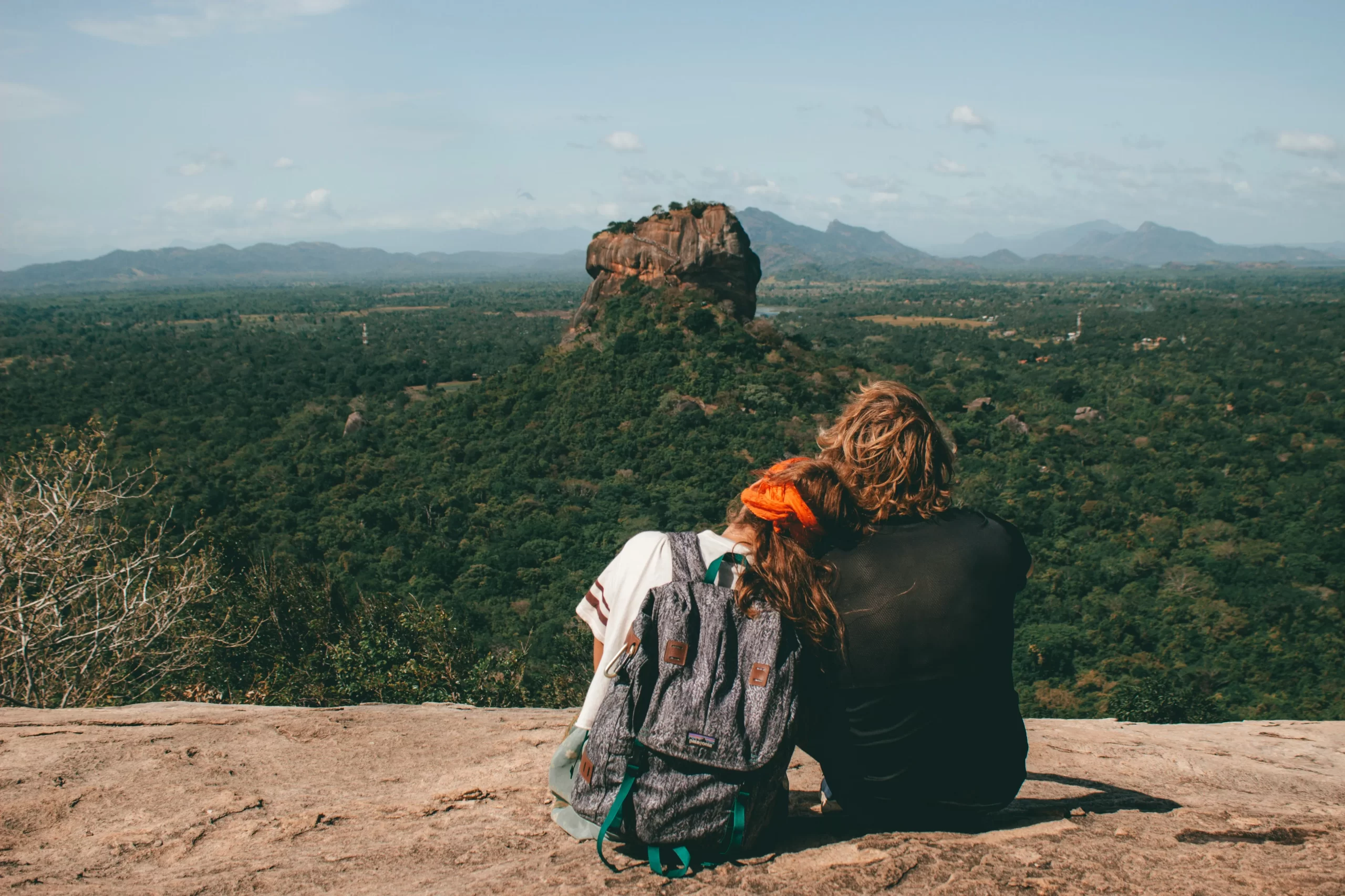 things to do in Sri Lanka - Sigiriya rock fortress rising above the jungle at sunrise
