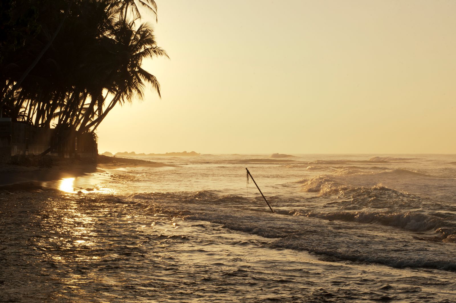 custom Sri Lanka tours - golden sunset over Unawatuna beach