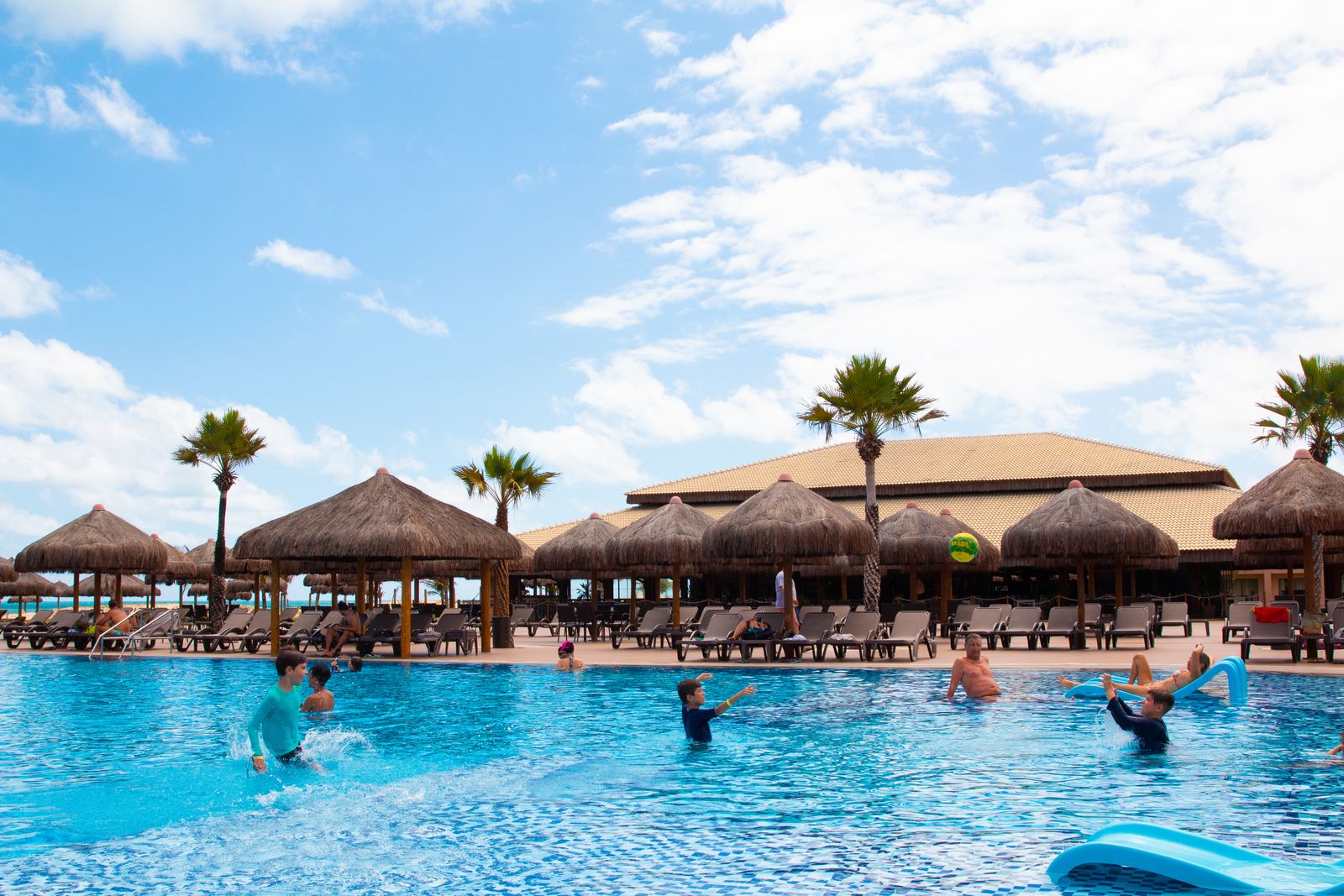 family friendly resorts Sri Lanka - a resort pool day under the palms