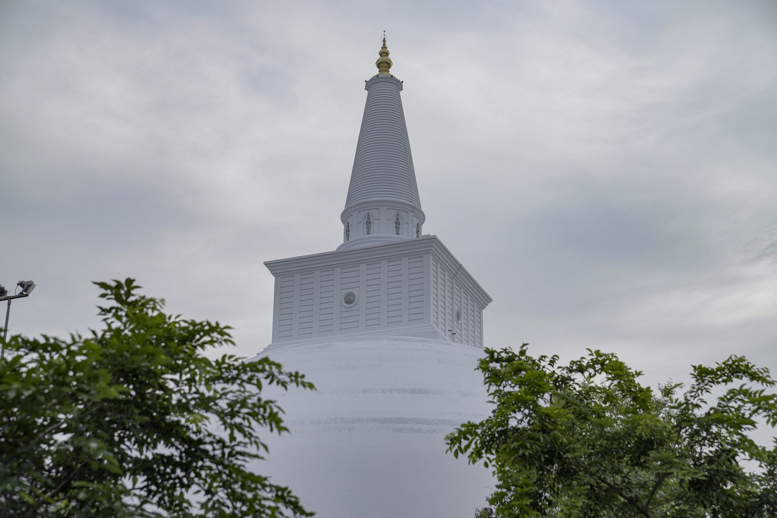 Anuradhapura sacred city - the white Ruwanwelisaya stupa under a cloudy sky