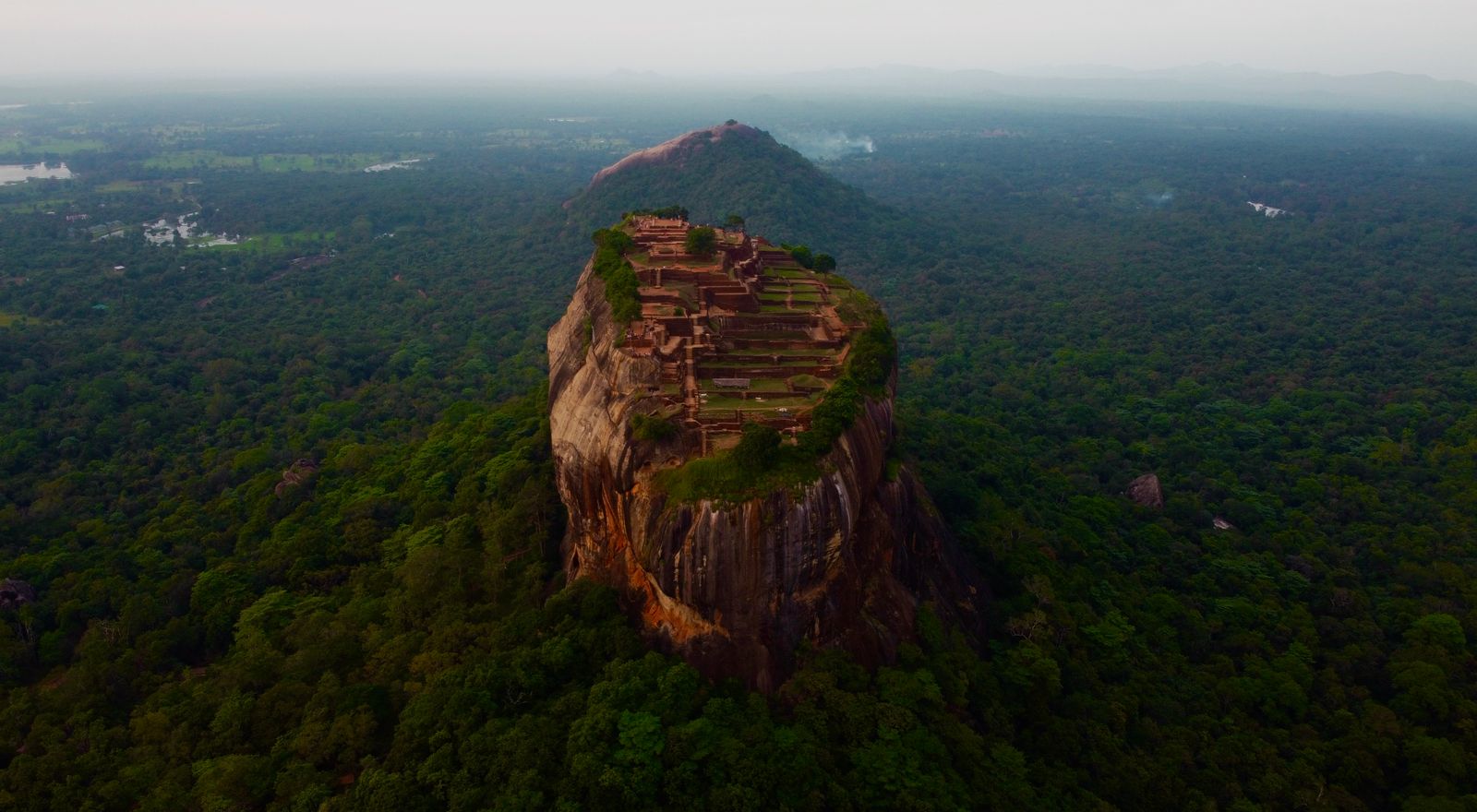 Sri Lanka Cultural Triangle tour - Sigiriya rock fortress rising above the jungle at sunrise