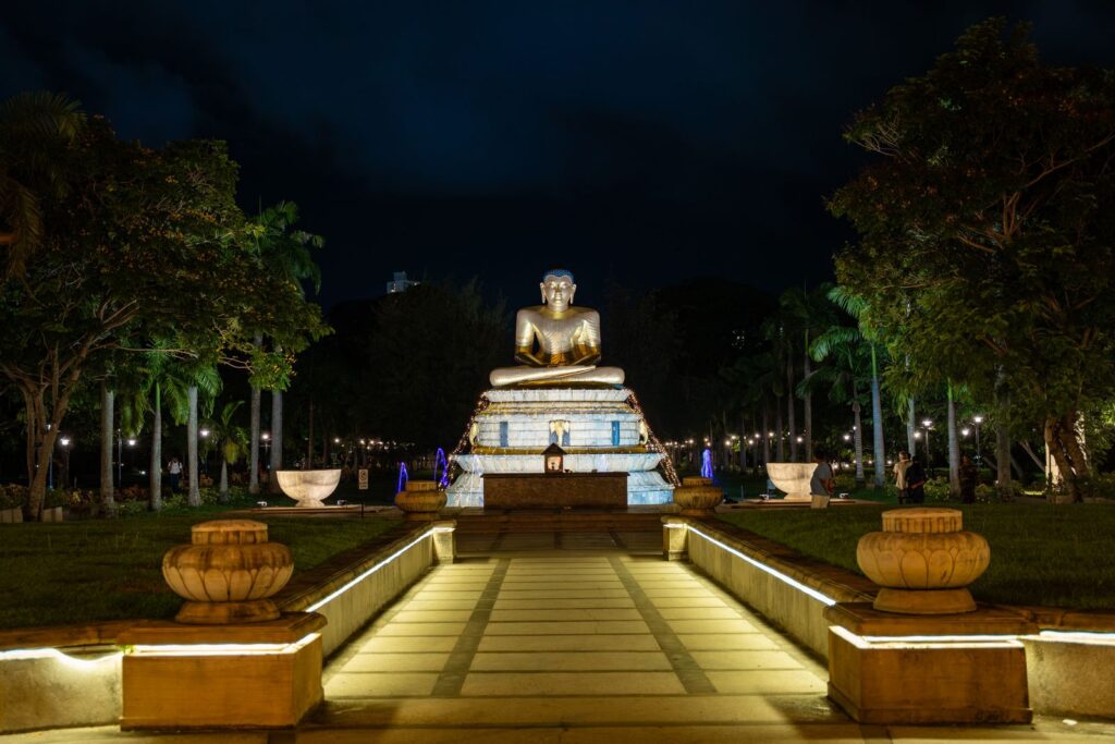 Kandy Esala Perahera 2026 - an illuminated Buddha statue at night during a Sri Lankan Buddhist festival